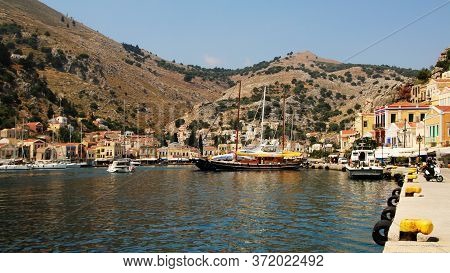 Symi, Greece - June 05, 2020: Symi Town, Symi Island, Pictorial View Of Colorful Houses And The Harb