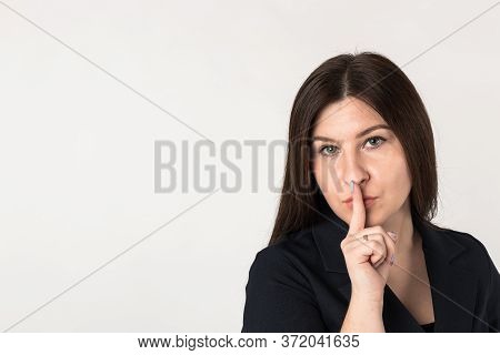 Woman And Silence. Shut Your Mouth. Finger On Lips. Shut Up.