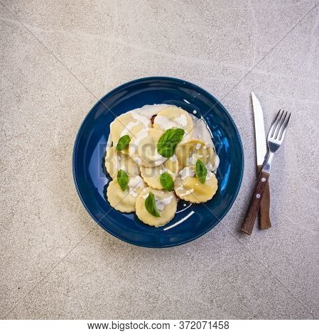 Mushrooms Agnolotti On Blue Plate. Traditional Dish Of Italian Cuisine