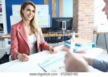 Portrait Of Stylish Young Woman In Presentable Suit Talking To Client. Well Dressed Female Employee 
