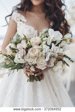 Vintage Portrait Of Pretty Bride With Flowers Outdoors In Wedding Day