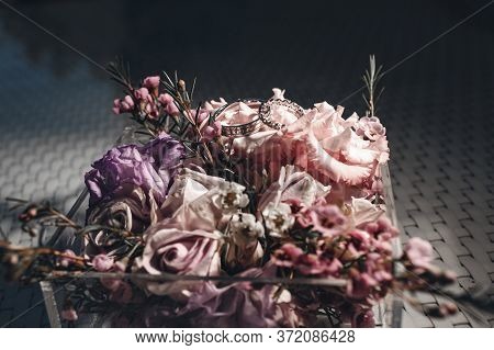 Wedding Rings Close Up Photo In Wedding Box With Flowers
