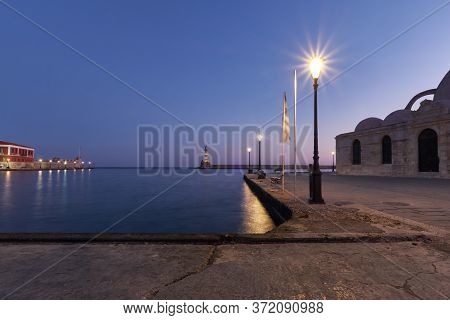 Old Venetian Harbour Xania Creta Greece Towards To The Lighthouse In Twilight, Ancient Lamps In The 