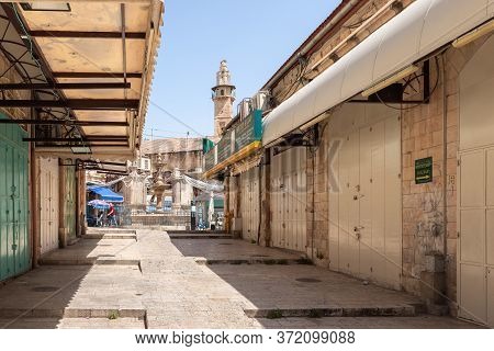 Jerusalem, Israel, June 13, 2020 : Street On The Arab Market Suq Aftimos With Closed Shops Leading T