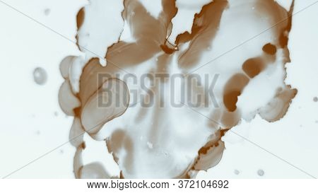 Magic Alcohol Ink Art.  Clouds Macro. Mokka Marble Style Texture. Cocoa Color Abstract Artistic Draw