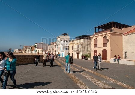 Alghero, Sardinia / Italy - April 10, 2011: Waterfront In The Coastal Town Of Alghero With Incidenta