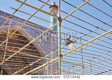 Isfahan, Iran: Persian Mosque In Time Of Repair Works, With Scaffolding Worker Over Imam Mosque On 1
