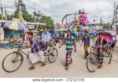 Bogra, Bangladesh - November 7, 2016: Rickshaws On A Street In Bogra, Bangladesh.