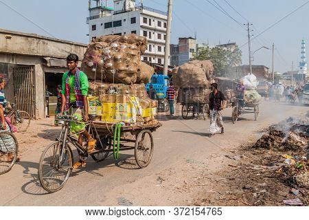 Dhaka, Bangladesh - November 22, 2016: Piles Of Garbage And Rickshaws At Sadarghat-gabtoli Road In C