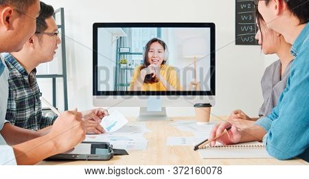 Group Of Young Asian Business People Video Conference With Colleague Woman. Remote Vdo Call Meeting,