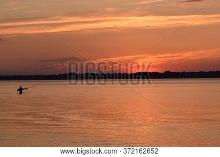 German Travel And Tourism Photo. Fishing At Sunset In The Eckernförde Bay, In Schleswig Holstein (no