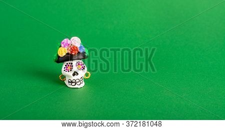A Catrina La Calavera Garbancera , Dapper Skeleton, Elegant Skull On A Green Background. Mexican Cul