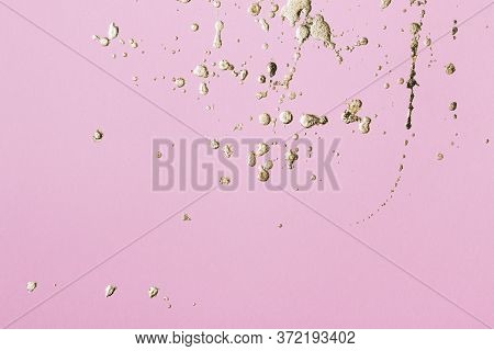 Pink Cardboard With Gold Potal Drops And Splashes. Creative Background, Copy Space