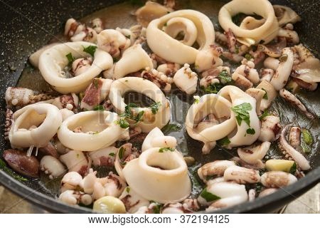 Squid Rings Made In Casserole As Sauce For Pasta Called Calamarata