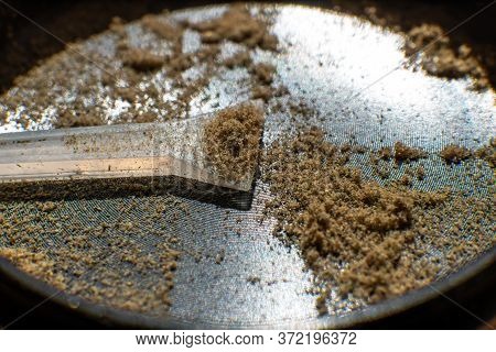 Kief Macro In Grinder. Sativa Medical Health. Close Up Vertical Shot. .