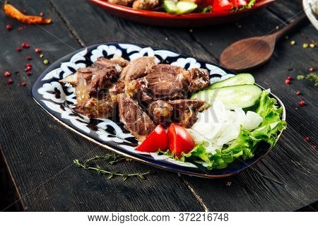 Jizz-byz - Traditional Roast In Azerbaijani Cuisine In The Wooden Table, Horizontal