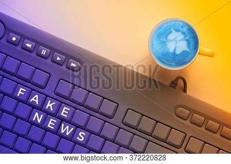 Text Fake News On Keys Of Keyboard, Close-up On Electronic Computer Keyboard With Warning Message To