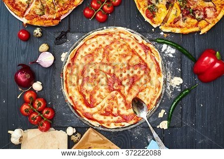 Cooking Pizza. Pizza Dough Topped With Tomato Sauce And Ingredients.