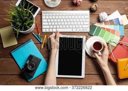 Freelancer Sitting At Desk And Tablet Computer. Business Occupation And Innovation Technology. Home 