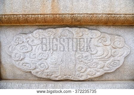 Kaesong, North Korea - May 5, 2019: Granite Bas-relief Depict A Holy Snake On The Wall Of Tomb Of Ki