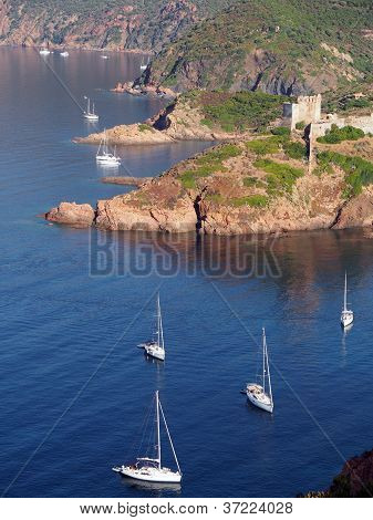 Sailboat and Girolata Genovese Fort , Corsica , France