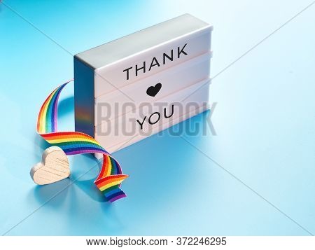 Lightbox With Text Thank You , Blue Mint Background. Heart, Rainbow Ribbon, Symbols Of Public Suppor