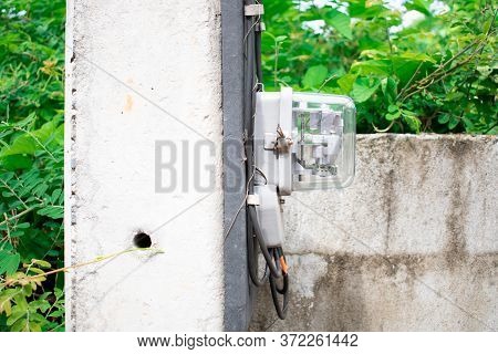 Gray Pole And Electronic Stuff  With Drity Wall And Green Background