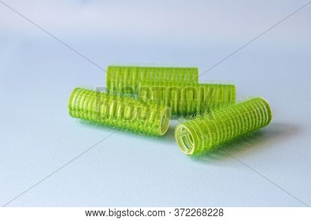 Hair Culers On The Blue Backround. Green Culers For Hairdress.