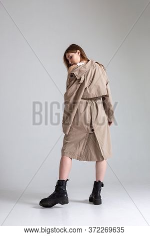 Attractive Caucasian Skinny Girl With Long Hair Posing On White Cyclorama. Beauty Portrait, Model Te