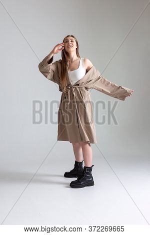 Attractive Caucasian Skinny Girl With Long Hair Posing On White Cyclorama. Beauty Portrait, Model Te