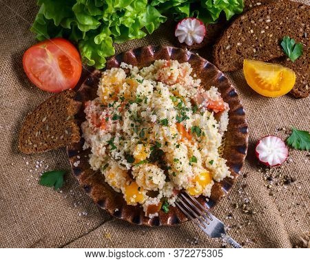 Homemade Fresh Couscous Salad With Tomatoes In Plate.