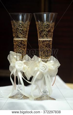 Two Wedding Glasses On The Table Close Up