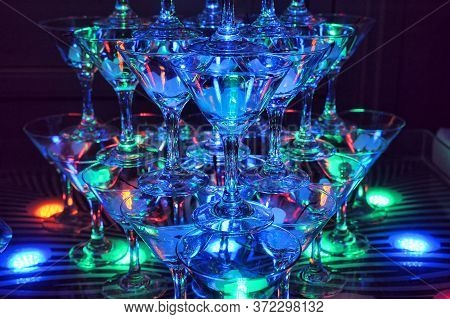 Pyramid Of Glasses With Light.