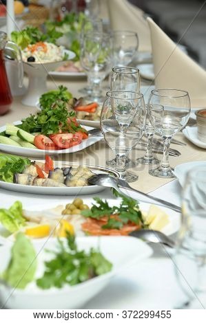 Served Table With Salads And Glasses Photo