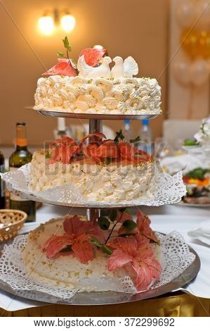 Detail Of Wedding Cake With Red Roses