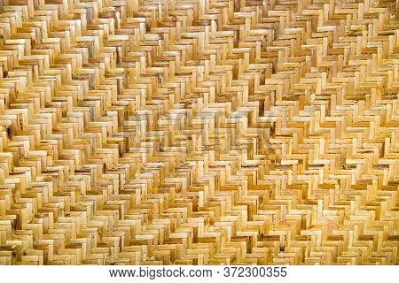 Background Of Woven Rattan Anthracite Yellow And White With A Beautiful Pattern In The Form Of A Lad