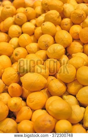 Colorful Display Of Lemons In Market Close Up