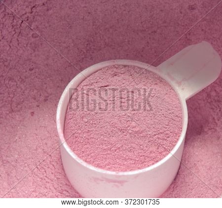 Whey Protein Powder And Scoop Close Up