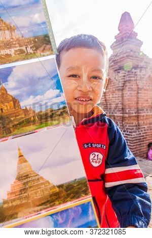 Bagan, Myanmar - December 9, 2016: Local Boy Selling Postcards At The Temple No 860 In Bagan, Myanma
