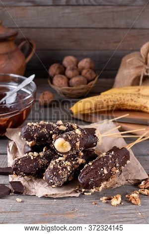 Homemade Frozen Chocolate Covered Bananas On A Stick. Sweet Dessert