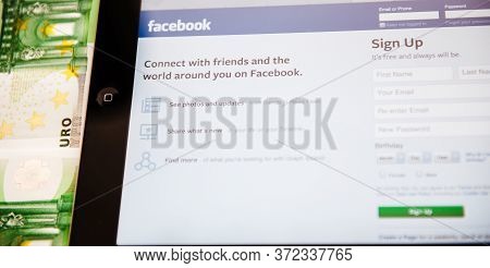 London, United Kingdom - Mar 17, 2014: Close-up Of Apple Computers Ipad Tablet With Facebook Sign Up