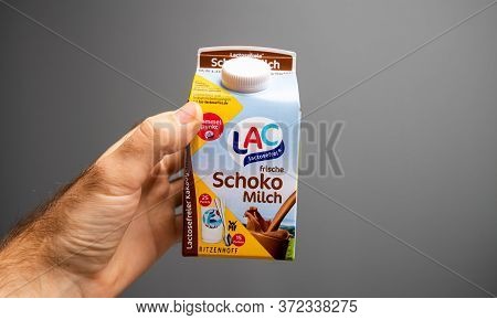 Paris, France - Oct 2, 2019: Male Hand Pov Personal Perspective Holding Against Light Gray Backgroun