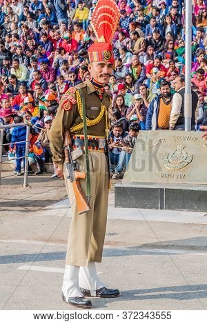 Wagah, India - January 26, 2017: Border Guard Watched By Indian Spectators At The Military Ceremony 