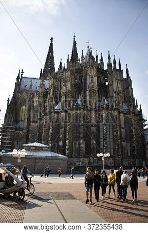 German People And Foreign Travelers Travel Visit And Respect Praying God At Cologne Cathedral Or Hoh
