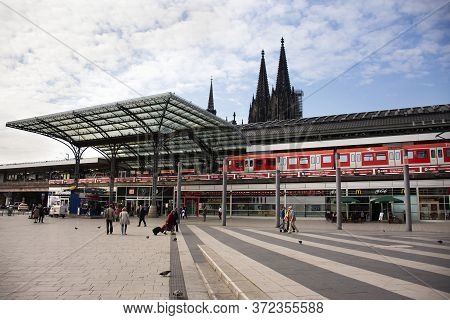 Landscape Cityscape And German And Foreign Travelers Walk At Front Of Koln Or Kolne Central Hauptbah