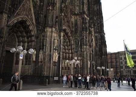 German People And Foreign Travelers Travel Visit And Respect Praying God At Cologne Cathedral Or Hoh