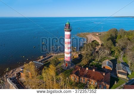 Shepelevsky Lighthouse On The Background Of The Gulf Of Finland On A Sunny May Day. Leningrad Region