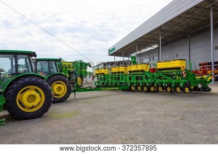 Kyiv, Ukraine - June 16, 2020: The Grain Seeder And Powerful Tractor John Deer At Kyiv, Ukraine On J