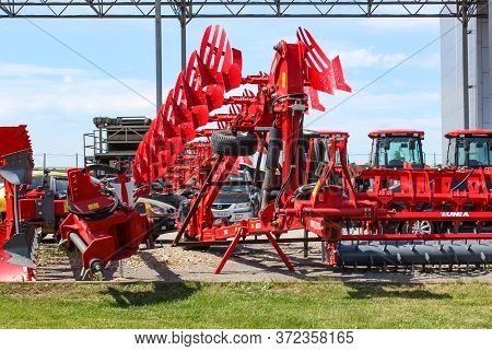 Kyiv, Ukraine - June 16, 2020: Large Disc Plough Unlu, Towing For Tractors To Plow Fields, Against T