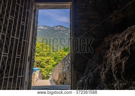 Door View Of A Path Leading Into The Mountains